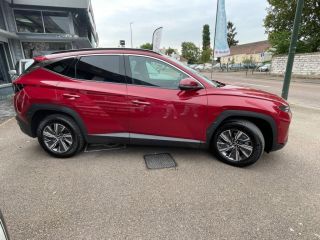 89100 : Hyundai Sens - APS - HYUNDAI Tucson - Tucson - Sunset Red Métal - Traction - Hybride : Essence/Electrique