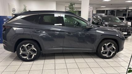 95500 : Hyundai Gonesse - ABVV - HYUNDAI TUCSON Executive - TUCSON IV - Gris - Boîte automatique - Essence / Courant électrique